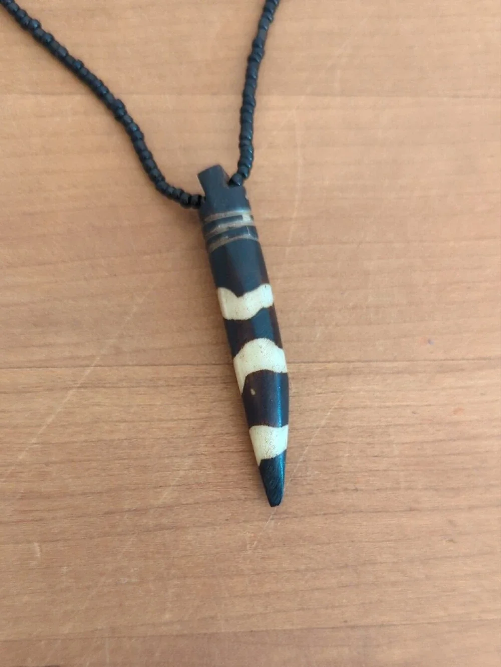 Handcrafted Black Beaded Pendant Necklace with Striped Horn Charm